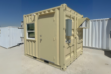 Load image into Gallery viewer, Beige shipping container with a door and window on a clear day