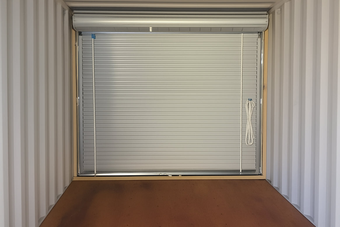 Window with blinds inside a container-like structure